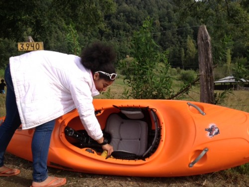 Dezaray sponges out water so her peers can wash the boat with a special spray that prevents an invasive algae from spreading from one river to another
