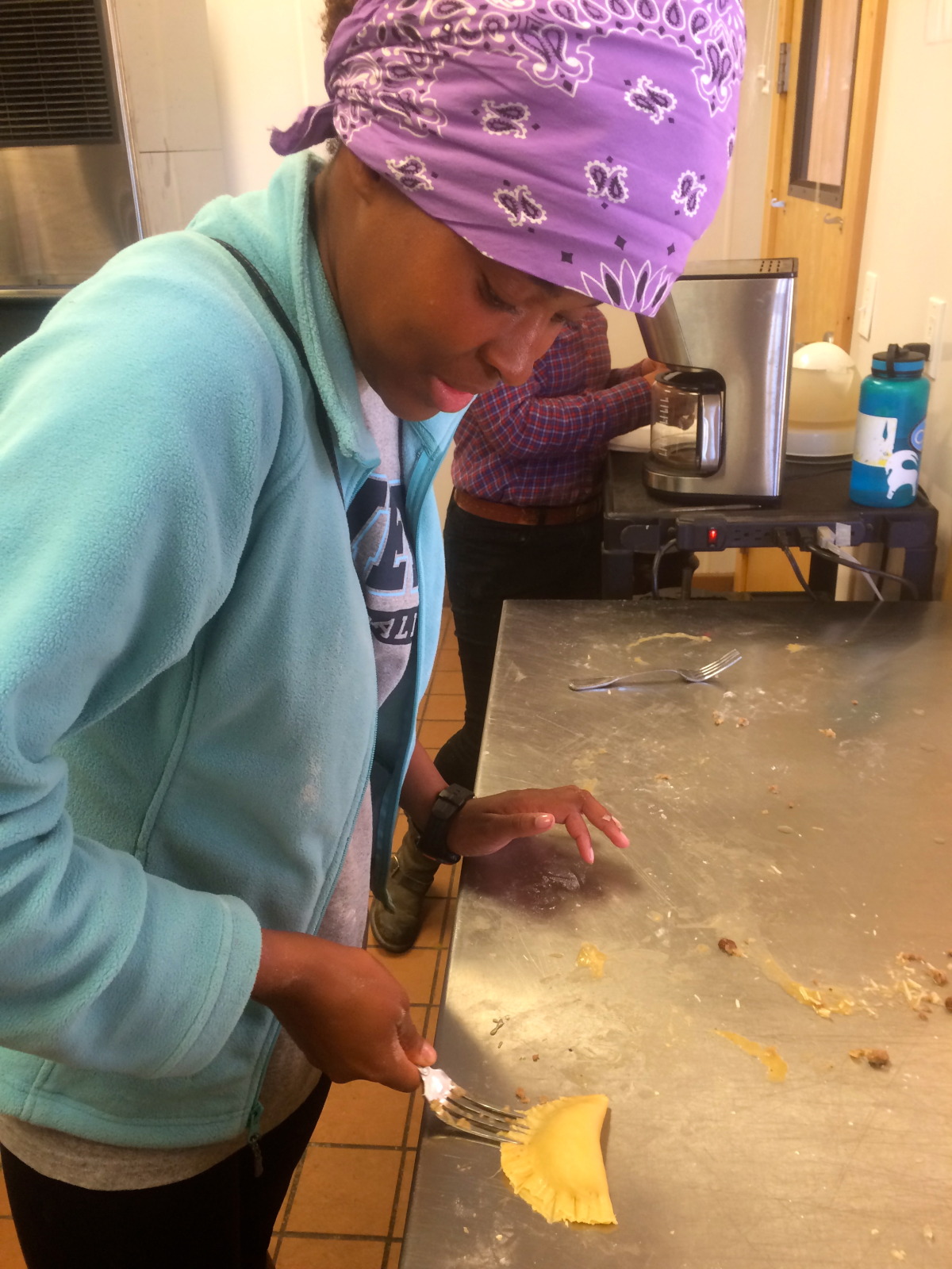 Veronica seals her empanadas with a fork!