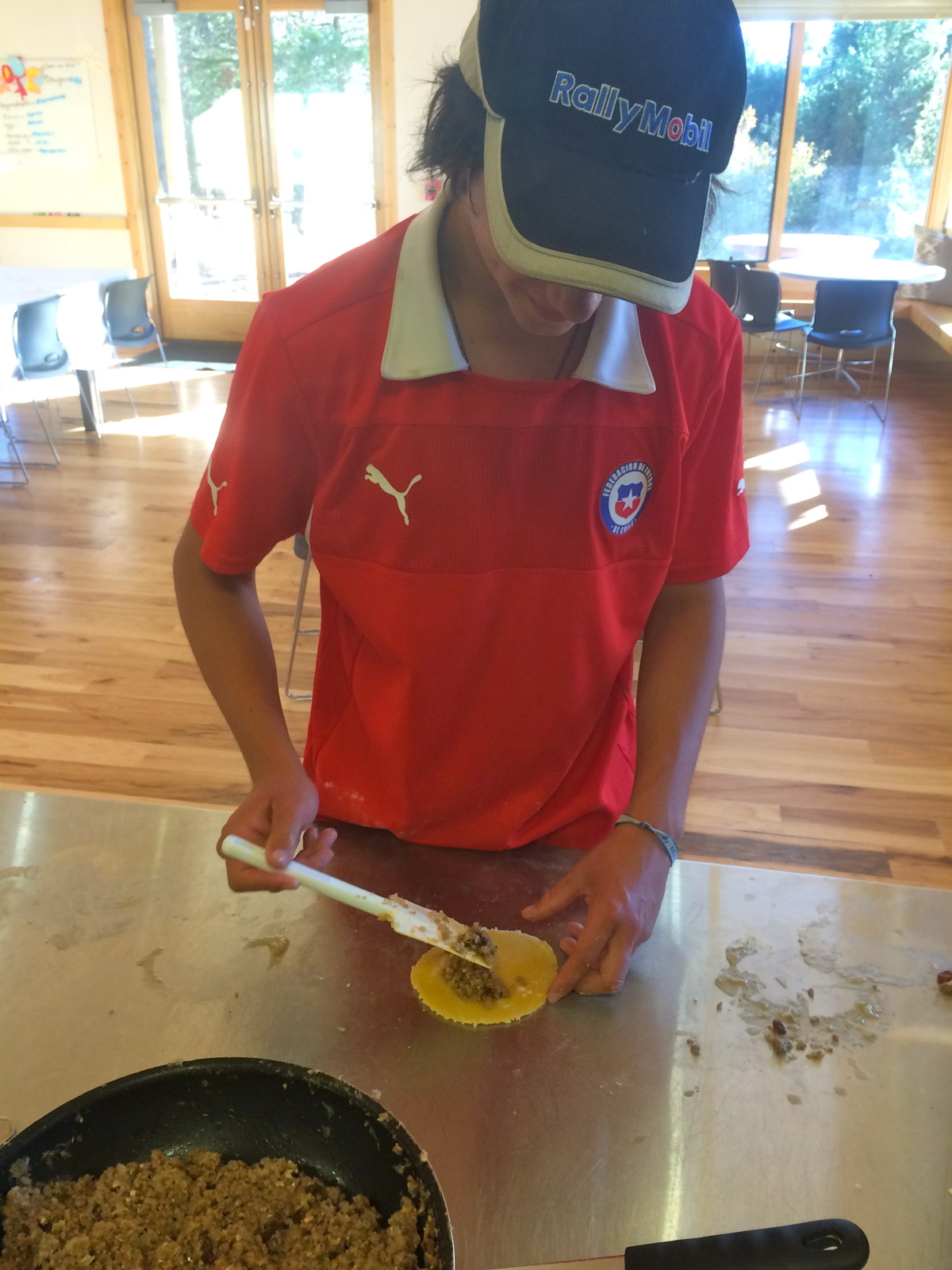 Filling the empanada like a pro!